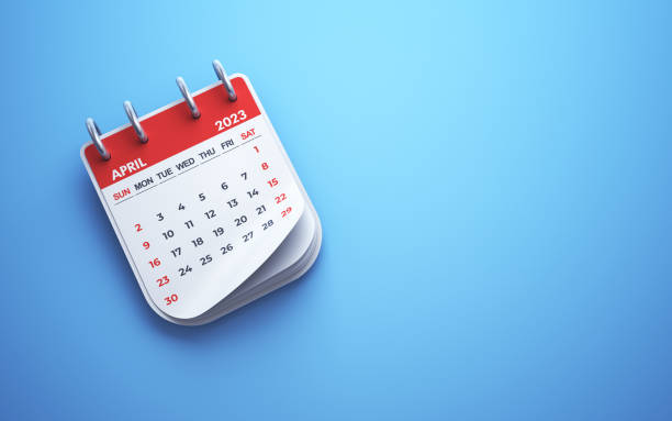 istock April 2023 Calendar on blue background, Desk Calendar 1460834111