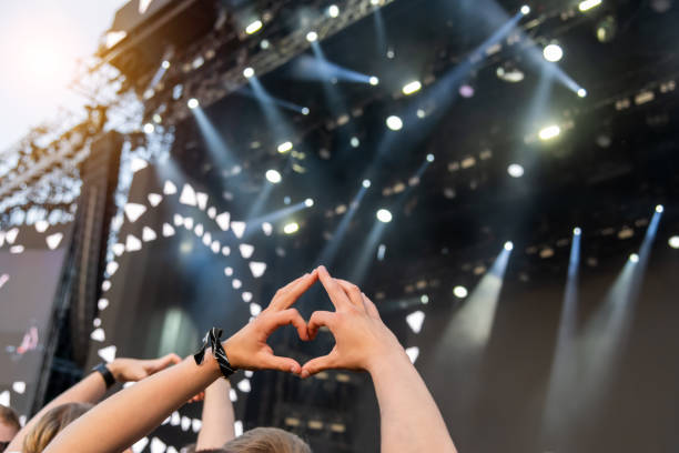 istock Heart shaped male hand at concert 1460834648