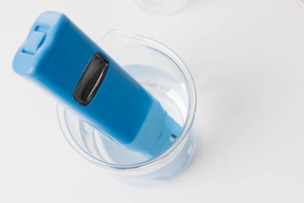 istock blue electrical conductivity meter for test drinking water in scient glassware on white background. digital EC TDS meter for the resercher in the industry labratory. top view photo. 1460835280
