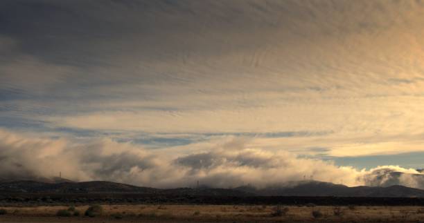 Dramatic backlit fog and clouds over San Gabriel mountains