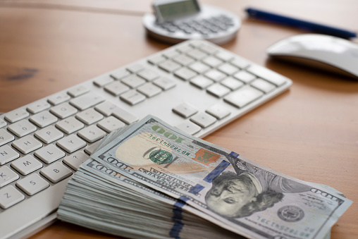 Keyboard with stack of money