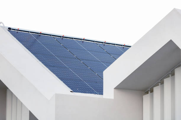 Solar panels. Close up of a roof covered with photovoltaic panels. solar panels on the roof of building in a city stock pictures, royalty-free photos & images
