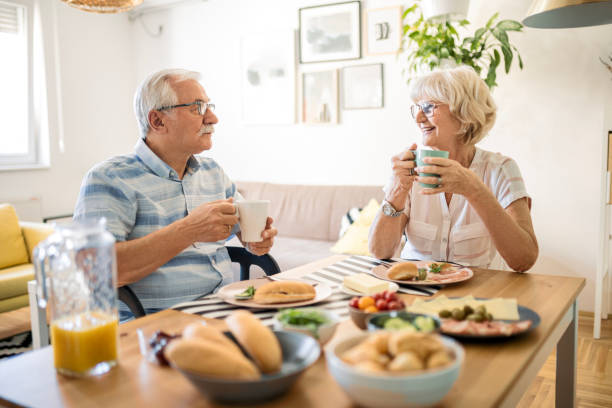 istock Happy smiling senior having breakfast 1460839658
