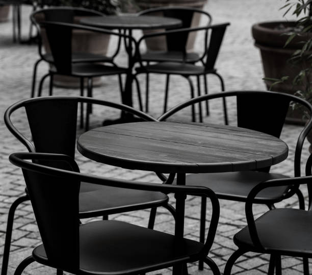 istock empty black tables and chairs of restaurant 1460841210
