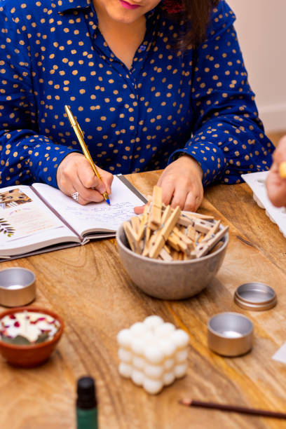 istock Businesswoman making notes in a notebook with a gold pen 1460841283