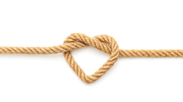 heart shaped knot on a rope - love red symbol valentines day imagens e fotografias de stock