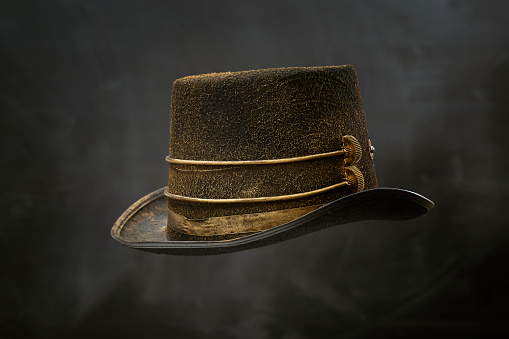 Steampunk cylinder hat on the grunge background