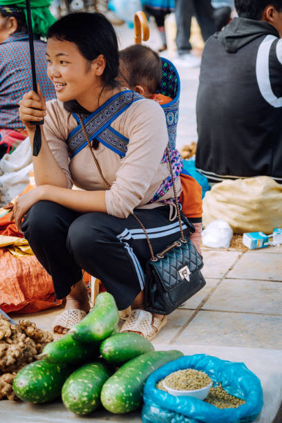 istock young woman selling vegetables and ginger 1460844603