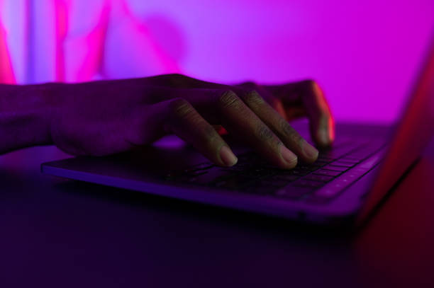 istock Male hands typing on the notebook keyboard. african american man working on computer 1460847990