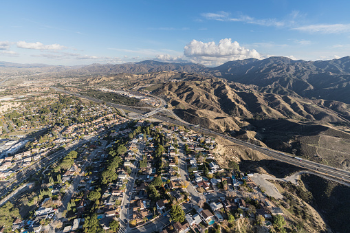 Aerial cityscape view of suburban sprawl in the Santa Clarita community of Los Angeles County, California.