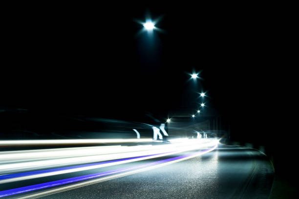 istock Dark tunnel with moving vehicle. Tunnel with light trails. 1460850982