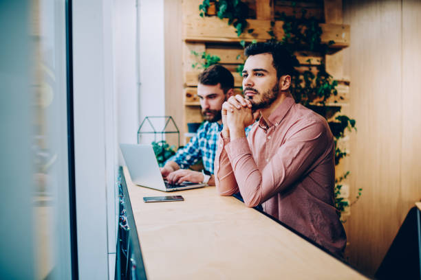 istock Wistful man in shirt in cafe 1460859733