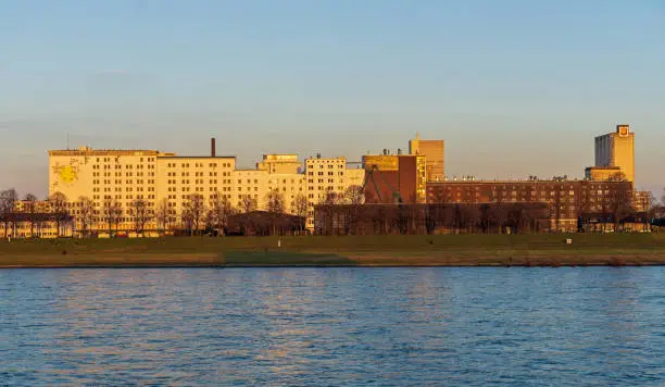 Cologne, January 2023: Rhine River Promenade at sunset, view to Deutz on the right side of the river