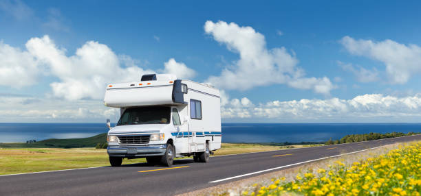 Vintage motor home driving on highway stock photo