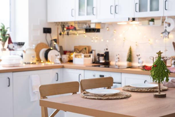 istock Festive Christmas decor and mess in the light kitchen, festive breakfast, white scandi interior. New Year, mood, cozy home 1460864008
