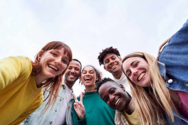 istock Copy space image of a multicultural group of friends taking a selfie, looking camera cheerfully. 1460864165