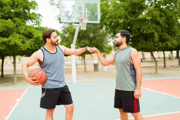 istock Active young men ready to play basketball together 1460866184