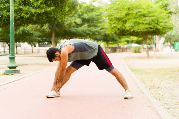 istock Fitness man doing warm up exercises 1460866232
