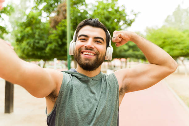 istock Fitness active man smiling doing a bicep curl 1460866268