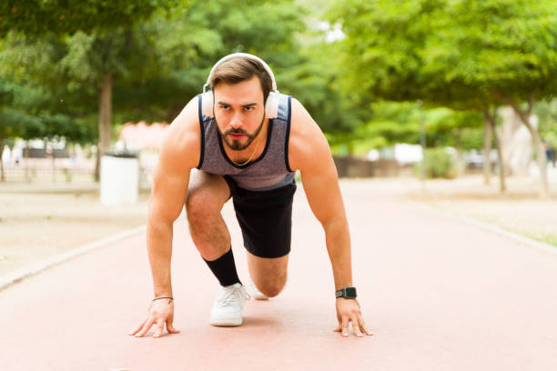 istock Attractive runner man preparing to start running 1460866339