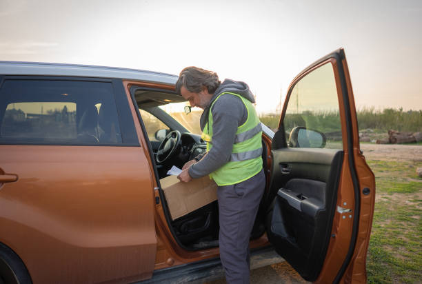 istock Delivery man preparing for delivery in delivery van 1460871532