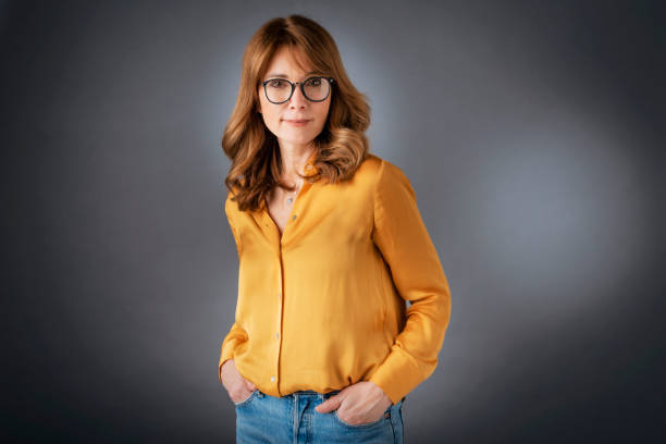 istock Smiling mature woman studio portrait 1460871716
