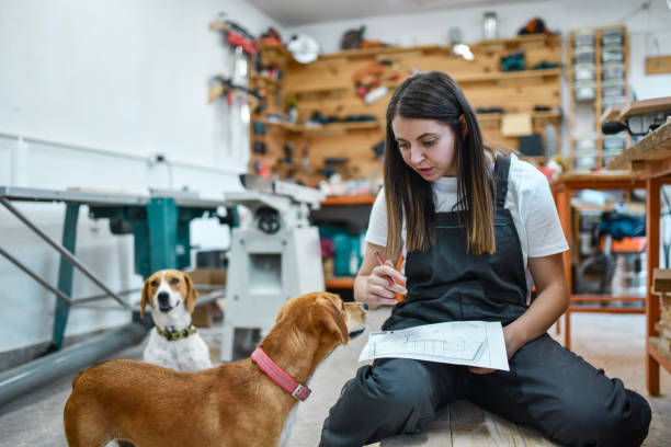 istock Female Talking To Puppies To Reduce Stress While Doing Interrior Design 1460872442