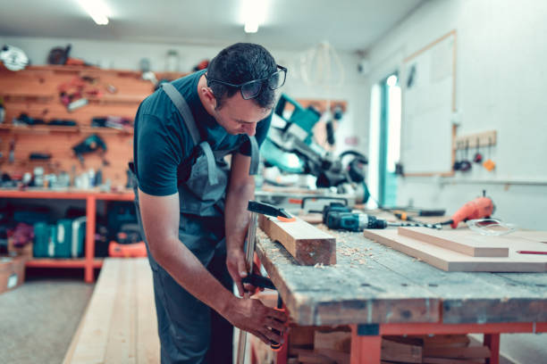 istock Clamp Used By Carpenter To Tighten Plank While Drilling 1460873594