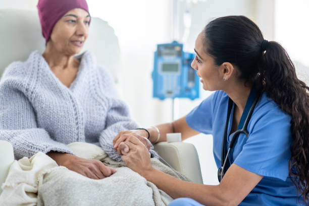 Nurse Talking with an Oncology Patient stock photo