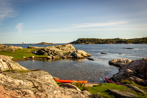 A couple of kayaks left on the islets called Dybingen in Kristiansand (Norway).