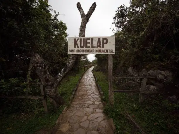 Photo of Entrance welcome sign name letter of Kuelap archaeological monument ancient citadel ruins andes cloud Amazonas Peru