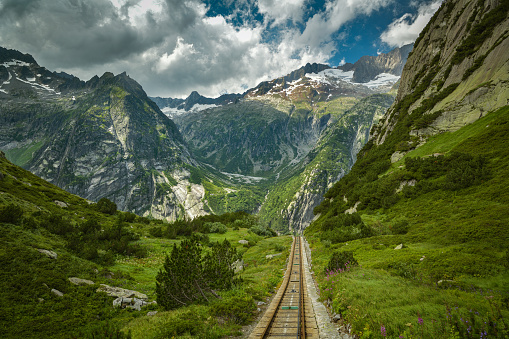 Track of Gelmer funicular, one of the steepest funiculars in the Europe, in Swiss Alps