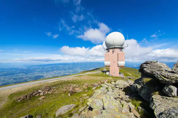 Radar buildings of the surveillance system Goldhaube at the Speikkogel mountain on a summer day