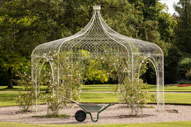 Wrought iron pergola in a park.