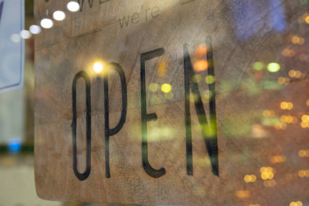 istock Wooden sign that says open 1460878561
