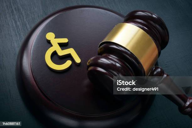 Disabled Person Sign And Gavel Accessibility Law Concept Stock Photo - Download Image Now