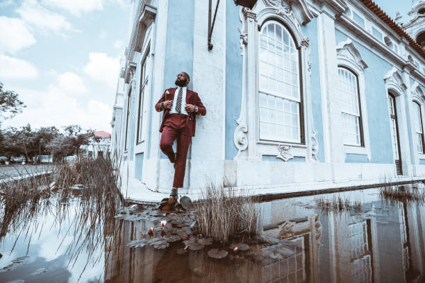 istock A black male against a corner house 1460882102