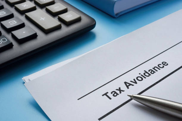 istock Papers about tax avoidance near the calculator. 1460883274