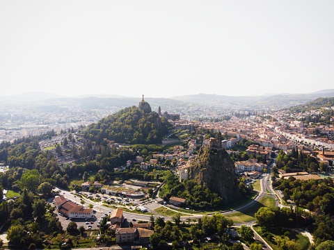 Aerial panorama of historic architecture french town Le Puy-en-Velay church on hill Haute Loire Auvergne Rhone Alpes France Europe