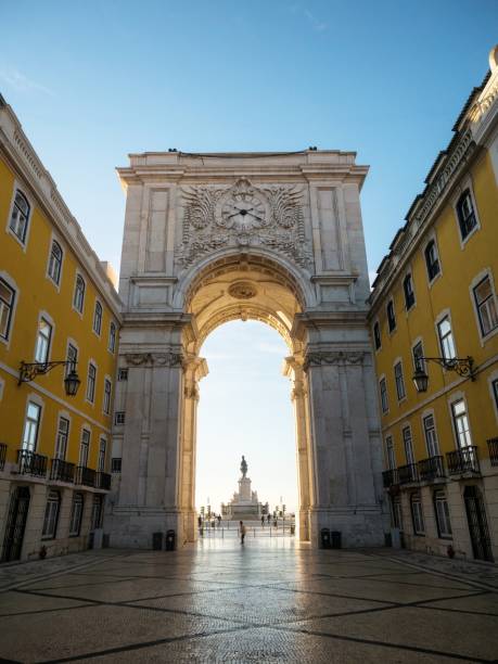 Panorama view of historic architecture triumphal arch Arco da Rua Augusta archway at Praca do Comercio Commerce main square downtown Lisbon Portugal Europe