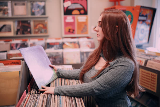 istock Woman Browsing LPs at Vintage Record Shop 1460885481