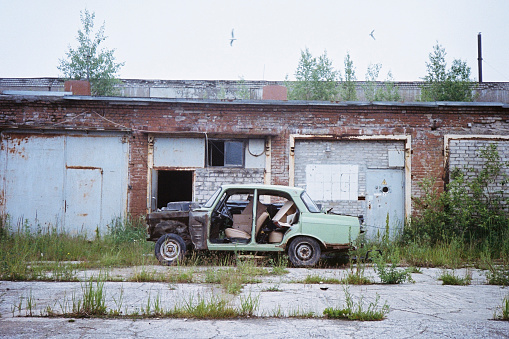 An old car is seen parked at the abandoned Soviet-ear prison in Rummu, Estonia.