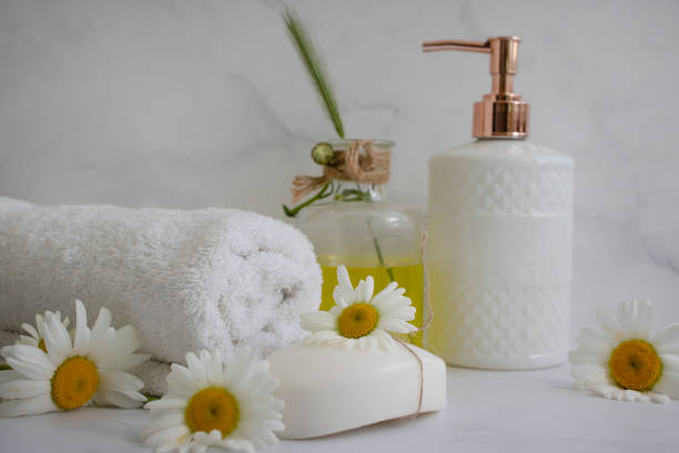 istock Cosmetic soap, chamomile flower on a light background 1460894220