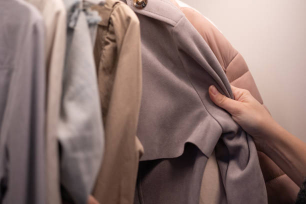 istock Hands Choose Clothes From the wardrobe 1460894606