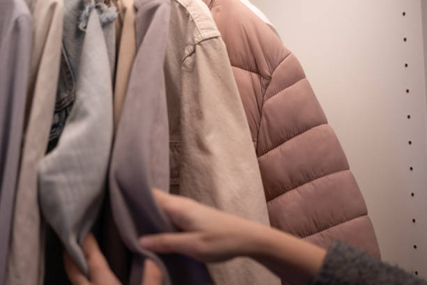 istock Hands Choose Clothes From the wardrobe 1460894612