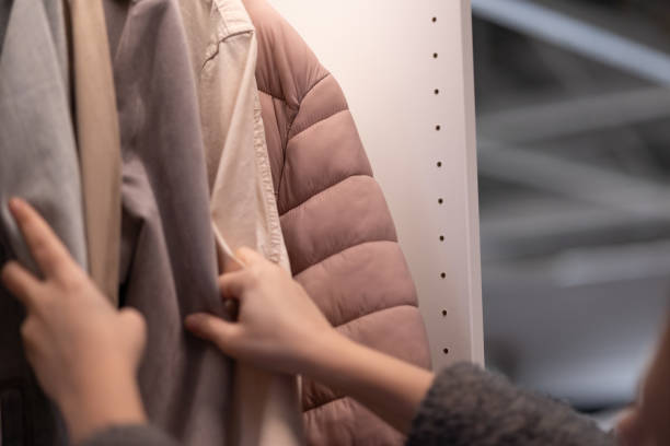 istock Hands Choose Clothes From the wardrobe 1460894646
