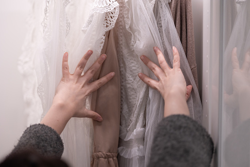 Hands Choose Clothes From the wardrobe