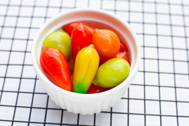 istock Fruit shaped of mung beans dessert (Kanom Look Choup). Thai Dessert 1460897977