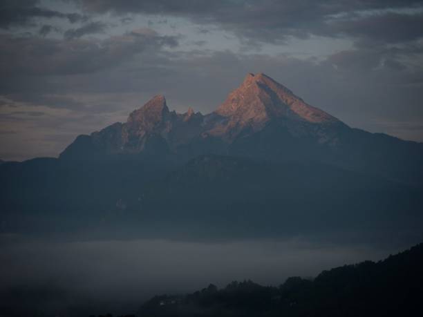 istock Panorama view of Watzmann alpine mountain range alpenglow from Marxenhoehe Berchtesgaden Upper Bavaria Germany alps 1460903059