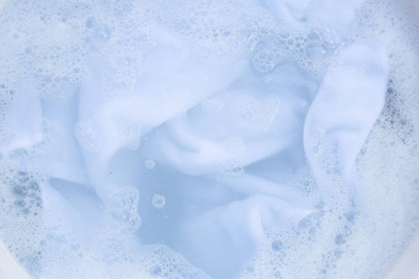 istock Top view of towel soak in powder detergent water dissolution. Laundry concept 1460904715